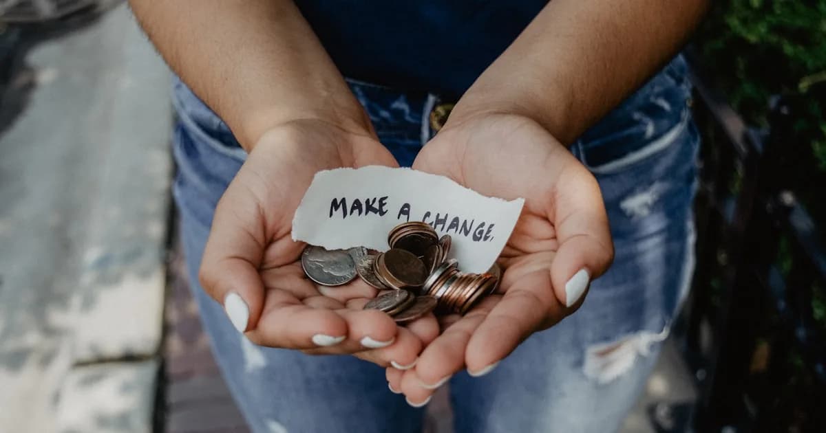 People joining hands together at a community fundraising event