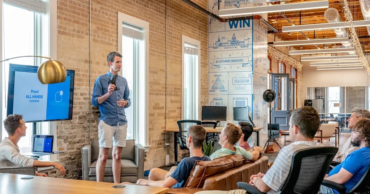 Sales team celebrating a win in a modern office