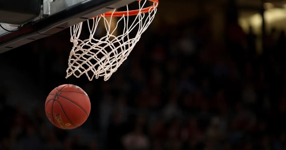 Basketball dropping through the net during a tournament game